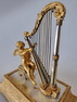 Musical Palais royal Ring stand and jewellery box, of Cupid with harp