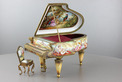 A large vintage Viennese enamel and gilt metal musical grand piano with chair