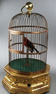 A large Antique hexagonal base antique single singing bird-in-cage, by Bontems