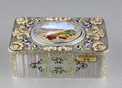 An exceptionally important and early silver, parcel-gilt, enamel and gilt appliques singing bird box, by Charles Bruguier