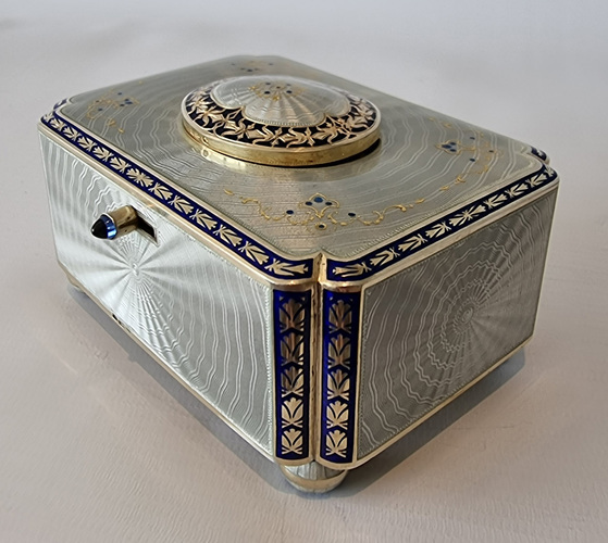 Silver gilt and full radial Guilloche enamel Singing bird box with original silver and enamel key and leather case
