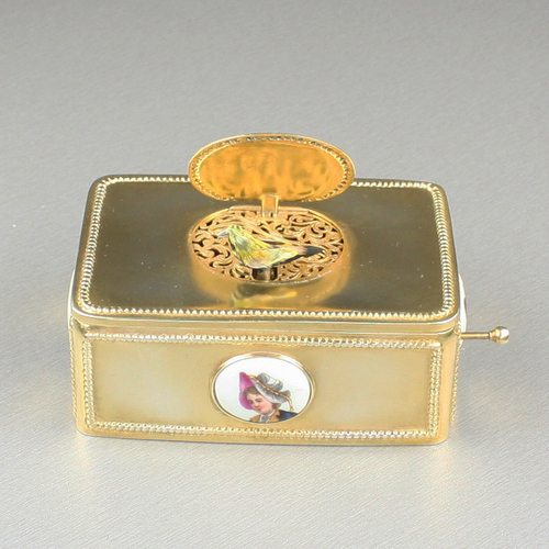 Silver-gilt and painted porcelain-bossed singing bird box, by B. F. of Germany