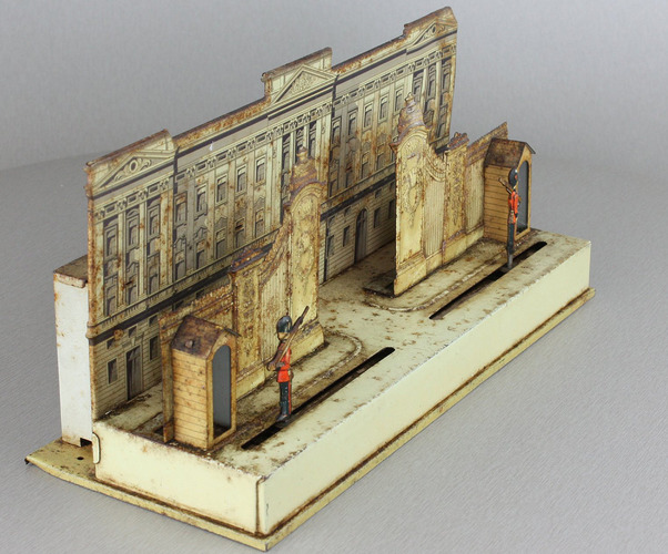 A small and unusual lithographed tinplate automaton  - 'The Changing of the Guard at Buckingham Palace'