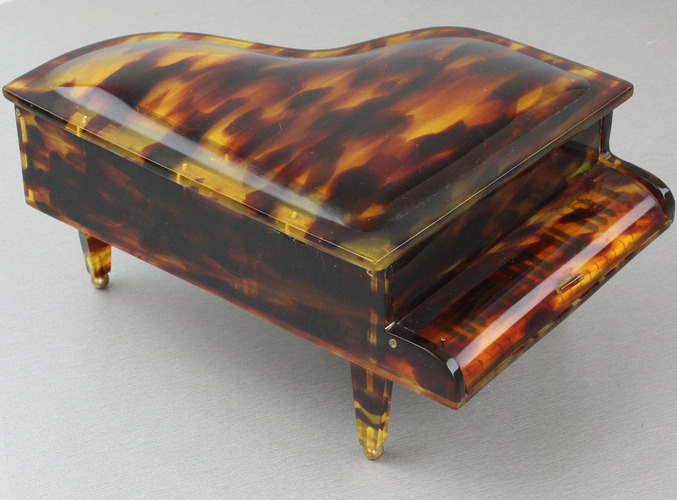 A vintage multi-tone faux tortoiseshell cased grand piano-form musical box