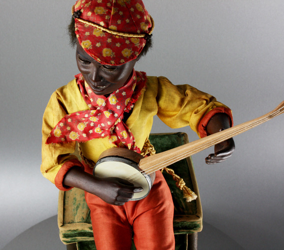 A very rare and fine antique black boy banjo player musical automaton, by Gustave Vichy