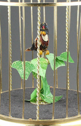 Small single singing bird-in-cage, by Karl Griesbaum