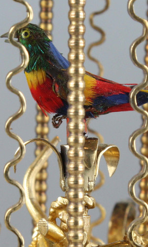 Miniature silver gilt, enamel, mother-of-pearl and turquoise mounted singing bird-in-cage, by Karl Griesbaum