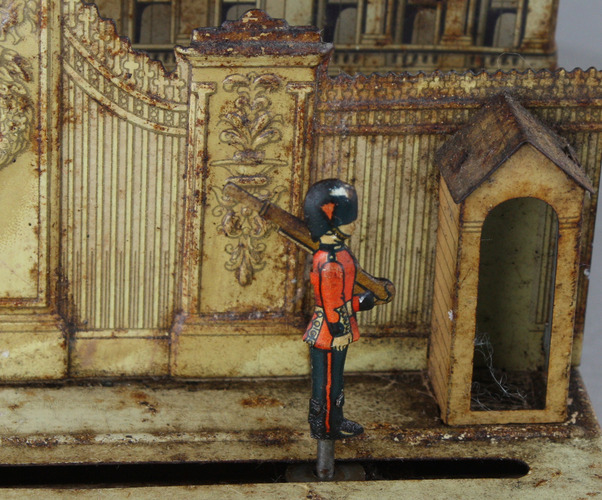 A small and unusual lithographed tinplate automaton  - 'The Changing of the Guard at Buckingham Palace'