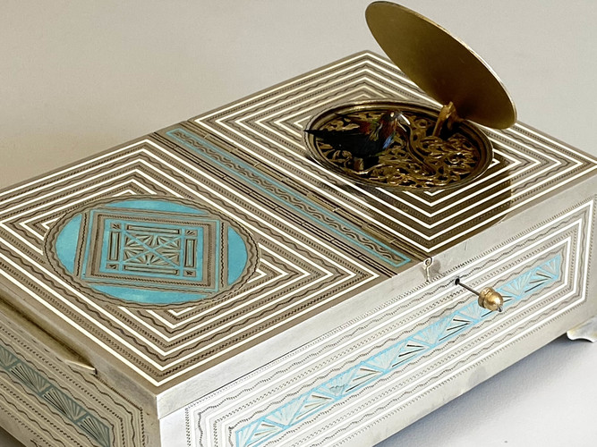 Silver and enamel Art Deco musical cigarette and singing bird box.