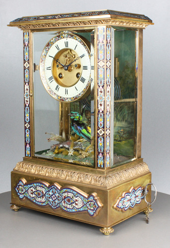 Rare antique gilt metal and champleve enamel timepiece-actuated singing bird, by Bontems